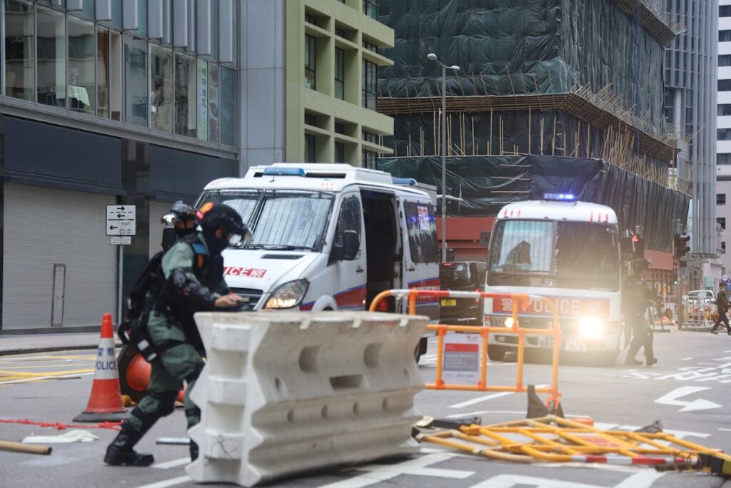 Military removing fence for passage of police car